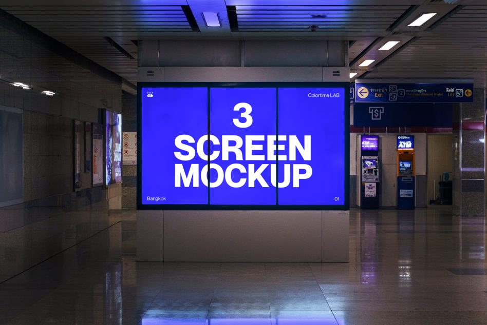 Three-panel blue LED display wall in modern subway station with white text