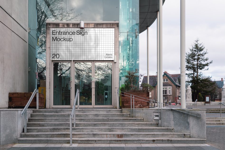 Modern office entrance with glass doors and mockup signboard, ideal for presenting branding designs and logos.