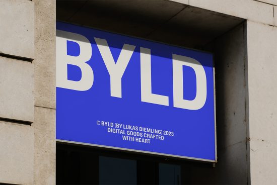 Blue signage mockup with bold white typography for branding and graphic design presentations, displayed on a building exterior.