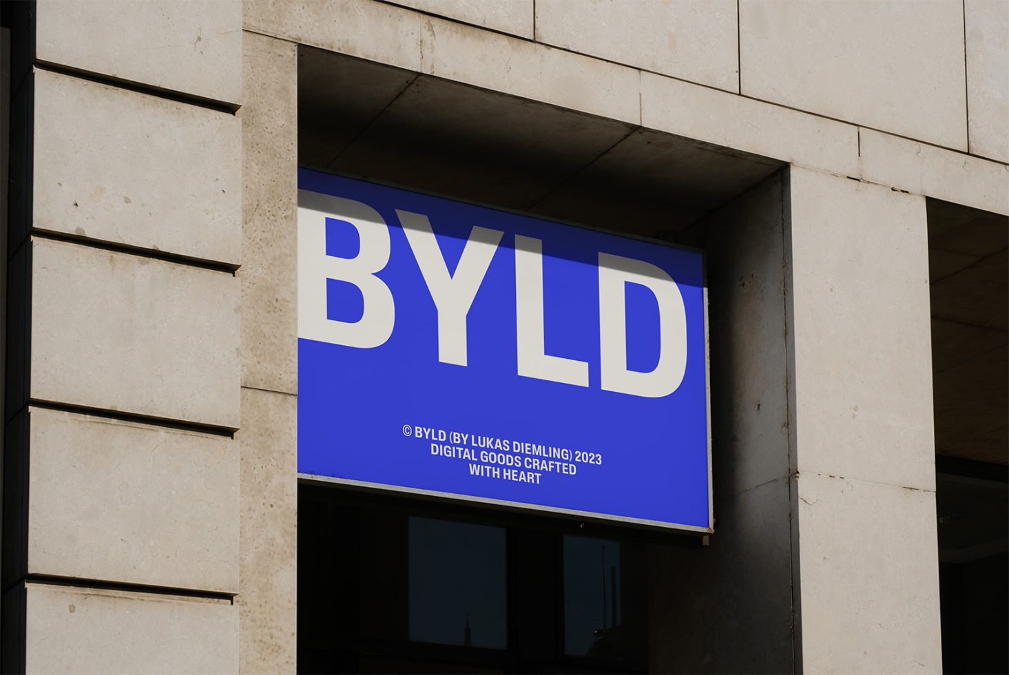 Storefront signboard mockup with bold typography in blue and white for outdoor advertising, ideal for showcasing branding and logo designs.