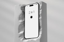 iPhone mockup showing 2 in 1 symbol text on white screen in stone