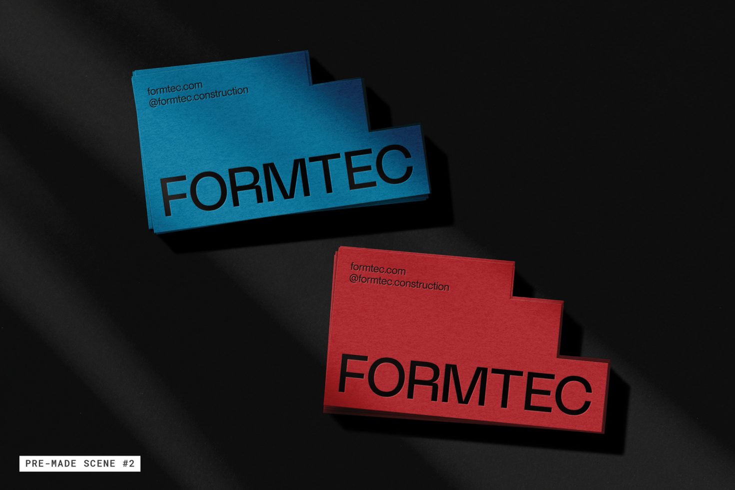 Business card mockup with blue and red cards on a dark background, showcasing branding for designers, ideal for graphic presentation.