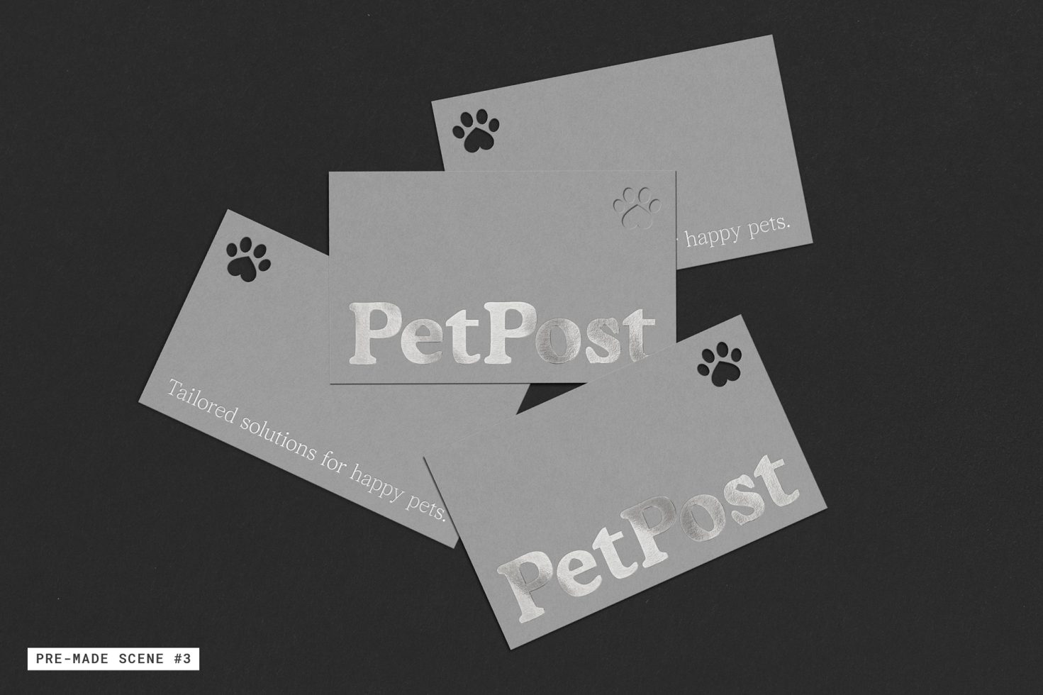 Business card mockup for pet brands with elegant silver text and paw print graphics on a dark background, perfect for designers' presentations.