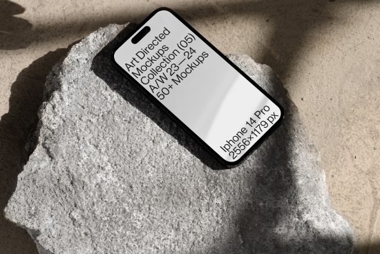 Smartphone mockup resting on a stone surface with natural shadows, ideal for presenting app designs in a realistic setting. Available in high resolution.