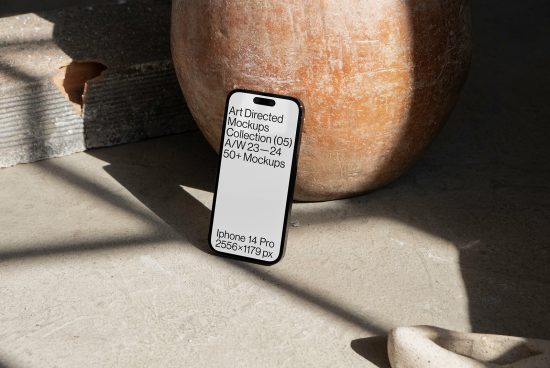 Smartphone mockup on concrete with shadows, natural lighting, iPhone 14 Pro display, design asset for templates category.