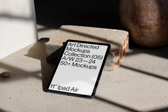 Modern iPad Air mockup on textured background with natural shadows for digital asset marketplace, ideal for presentations and showcasing design work.
