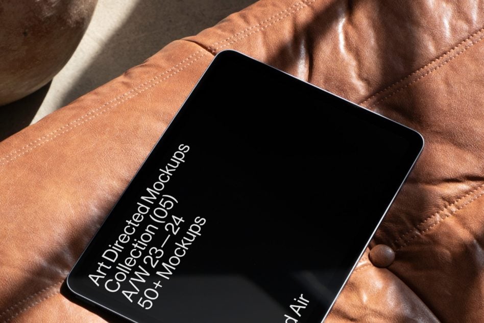 iPad Air on brown leather jacket with dark display