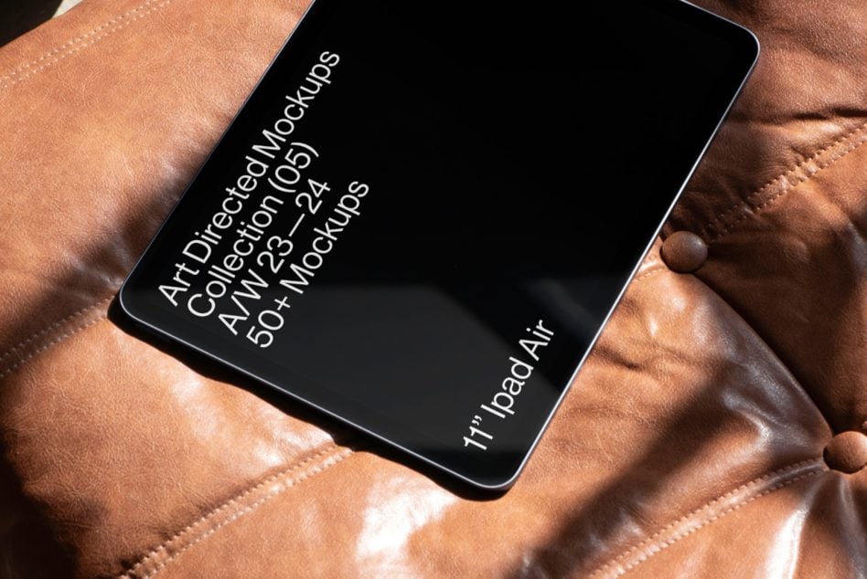 iPad Air on caramel leather with dark screen showing text
