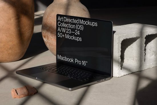 Art directed laptop mockup displaying screen, ideal for presentations, in a stylish setup with shadows and textures, perfect for designers.