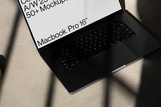 Laptop mockup on a desk in sunlight, ideal for presenting digital design work or web templates to creative professionals.