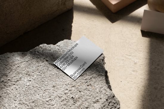 Creative business card mockup on textured stone with natural shadows, ideal for designers looking to showcase stationery designs.