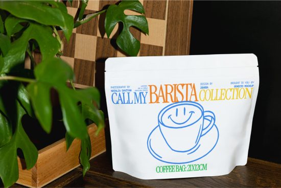 Printed coffee bag packaging mockup design with smiling cup graphic near a green plant, showcasing product branding and packaging.