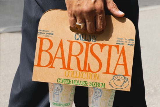 Person holding a custom coffee holder mockup with Barista Collection design, ideal for showcase in graphics or templates category.