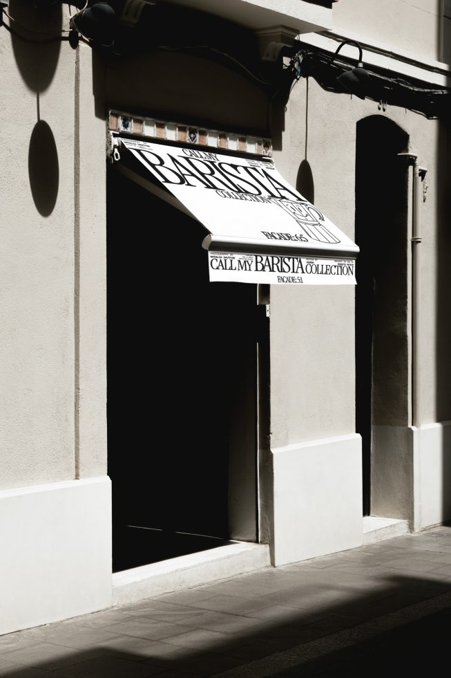 Storefront awning mockup with elegant typography design in a realistic urban setting, perfect for brand presentations, graphics display.