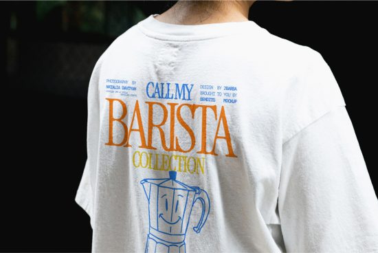 Person wearing white T-shirt with colorful typography design, barista collection graphic mockup, apparel branding example.