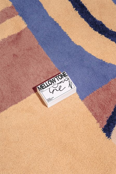 Vivid carpet texture with a stack of design cards, ideal for graphics and mockups section for creative designers seeking inspiration and materials.