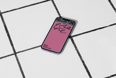 Smartphone mockup on tiled floor displaying screen design, ideal for presentations, digital assets, designers' portfolios with editable layers.