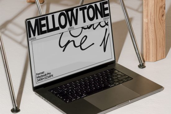Laptop mockup displaying a calligraphy font titled MELLOWTONE, showcasing design versatility in a realistic setting for creatives.