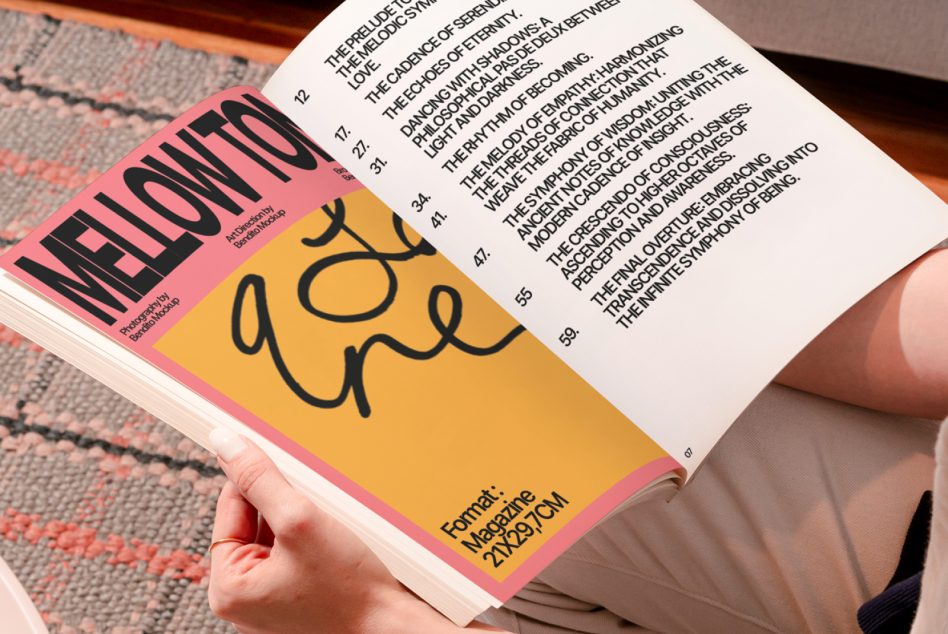 Person holding open magazine mockup featuring bold typography design, for layout and font showcase, graphic design inspiration.