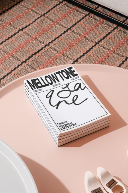 Elegant magazine mockup on pink table with stylish shoes, showcasing modern graphic design, perfect for presentations and portfolio.