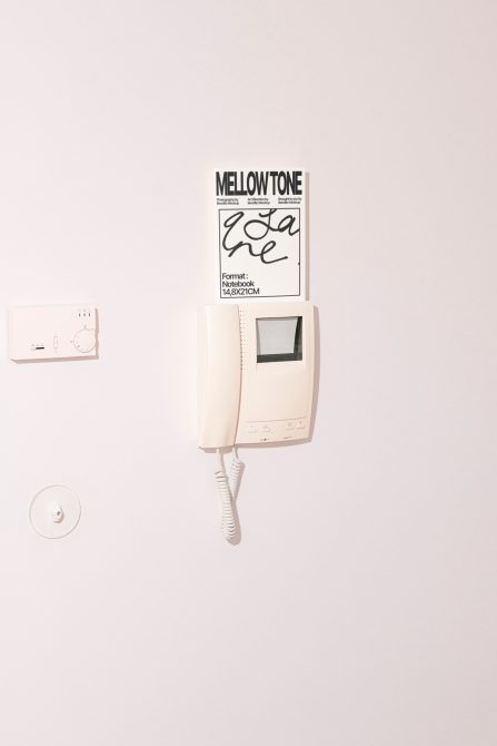 Mellow tone poster on vintage intercom system mounted on wall