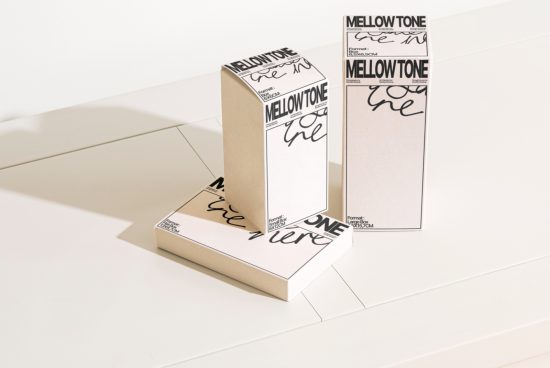 Elegant packaging mockup showcasing two cardboard boxes with stylish font design in a bright studio setting, ideal for presentations and branding.