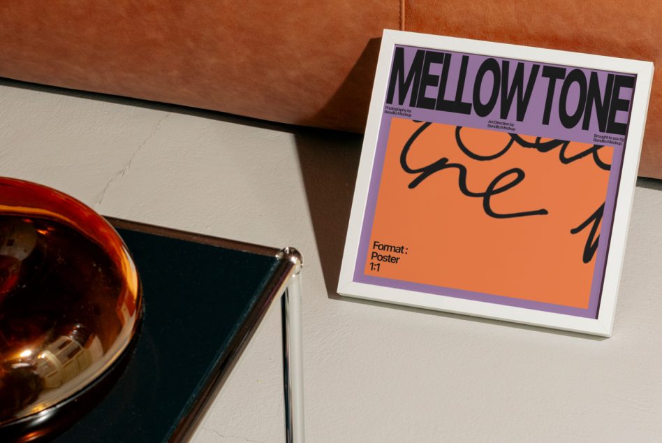 Mellow Tone poster with purple border, orange center section, framed on wall