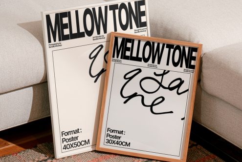 Mockup poster frames with stylish script font, indicating sizes 40x50cm and 30x40cm, leaning against a sofa on a patterned rug. Perfect for designers.