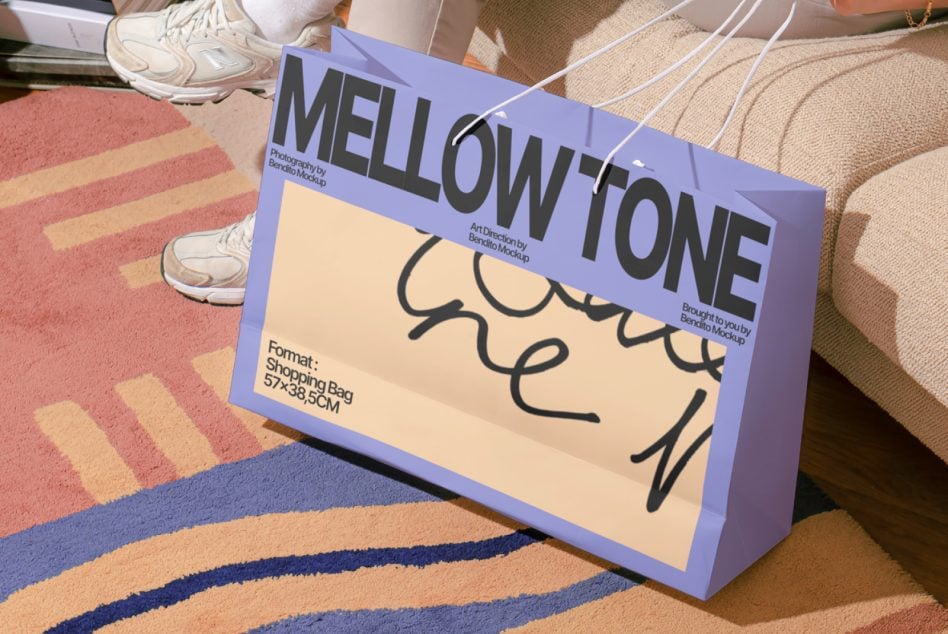 Purple shopping bag mockup displaying Mellow Tone design on patterned floor