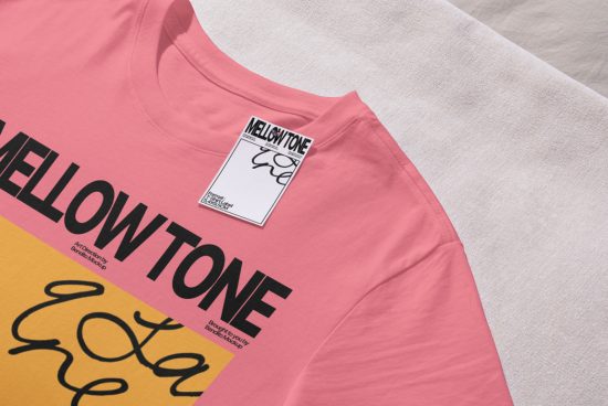 Pink t-shirt mockup with graphic design and label, stylish apparel presentation, clothing design template for online showcase.