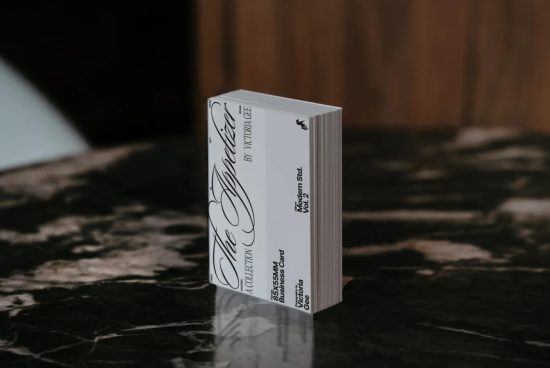 Elegant business card stack mockup on marble surface, showcasing script font design, essential for presentation and branding.