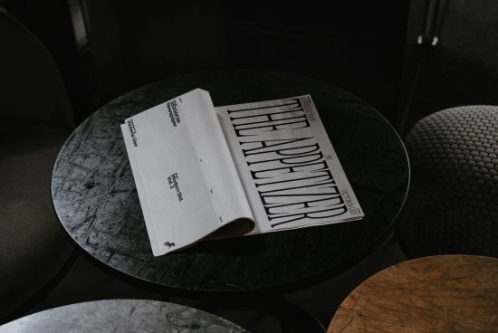 Elegant magazine mockup on a marble table, showcasing stylish typography design, ideal for presentations and digital assets for designers.