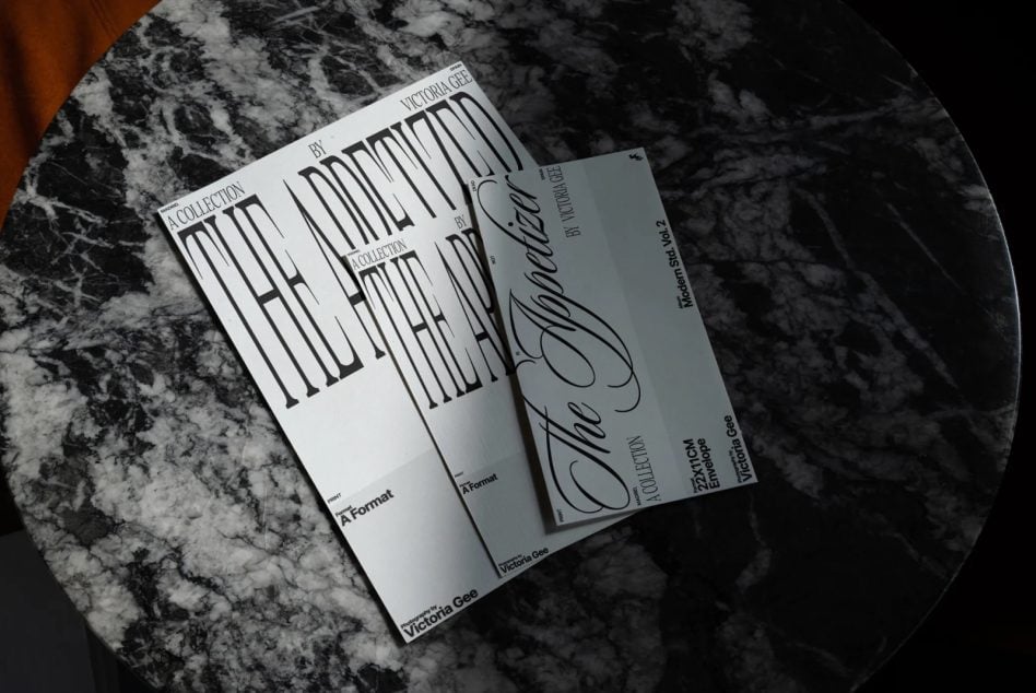Print mockups arranged on round marble table, minimalist striped typography layout