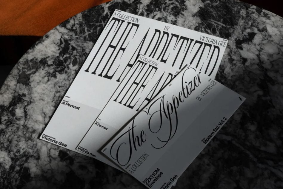 Overlapping envelope mockups with serif lettering design on black marble surface