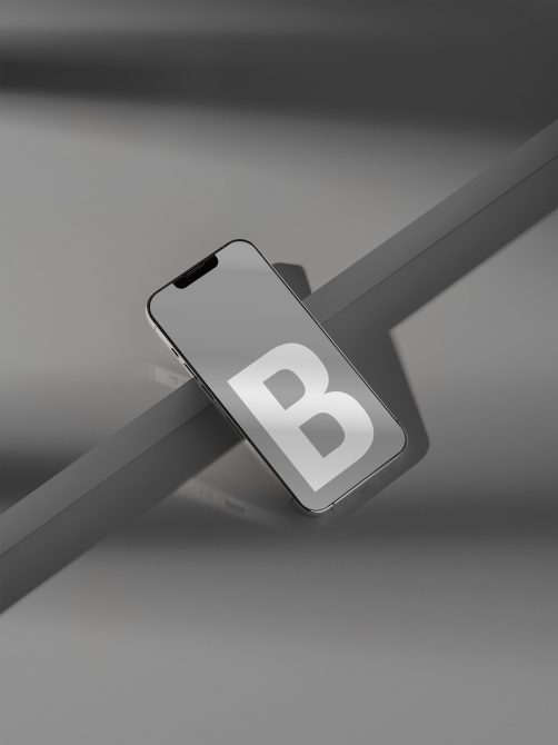 Smartphone mockup on gray background with letter B on screen, ideal for app design presentation suitable for designers.