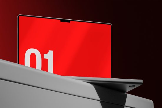 Modern laptop mockup with red screen displaying number one on sleek grey platform with a dark background, ideal for presentations and branding.