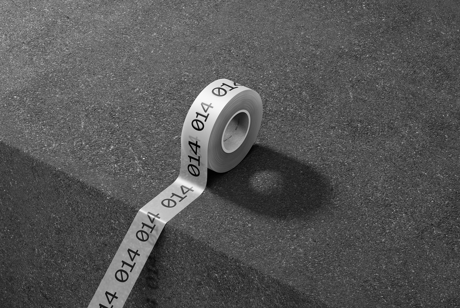 Measuring tape on asphalt surface displaying numbers, focusing on precision, measurement, tool graphics, in a monochrome design concept.