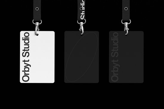 Three different ID badge mockups with lanyards on a dark background, showcasing branding for Orbit Studio in various shades of black and white.