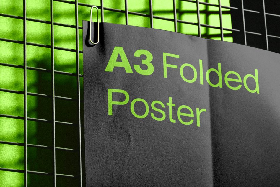 A3 Folded Poster Mockup clip on metal grid, green neon light effect. Perfect for designers to showcase poster designs.