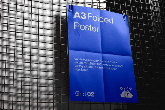 A3 folded poster mockup on metal grid, blue with typography, realistic shadows, design presentation, digital asset for graphic designers.
