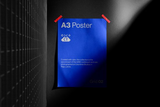 Blue A3 poster mockup with pixelated design elements, taped on a dark textured wall, showcasing realistic shadows and lighting, suitable for graphic presentations.