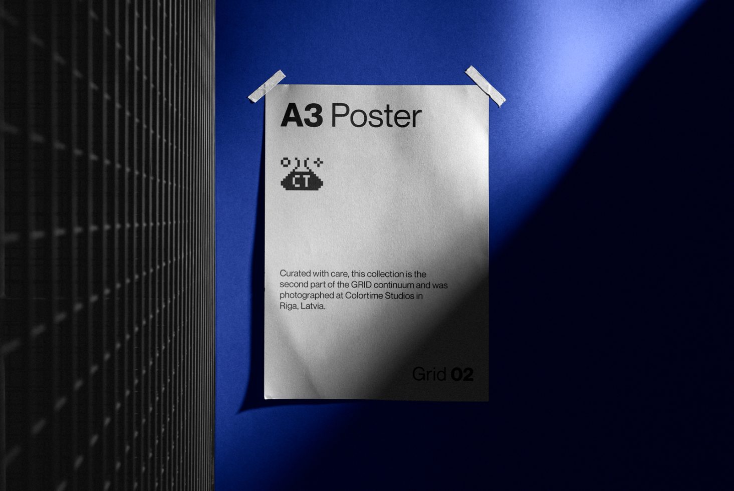 A3 poster mockup taped to a wall with dynamic shadows, ideal for presentations and graphic design showcases, with modern aesthetic.