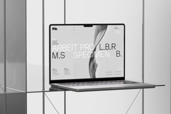 Laptop on glass table displaying font specimen for ARBEIT PRO, a modern sans-serif typeface, in a clean elegant mockup setting.