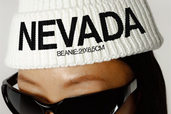 Close-up of a person in a white beanie with NEVADA text, wearing sunglasses, ideal for fashion mockups, apparel design, and branding.