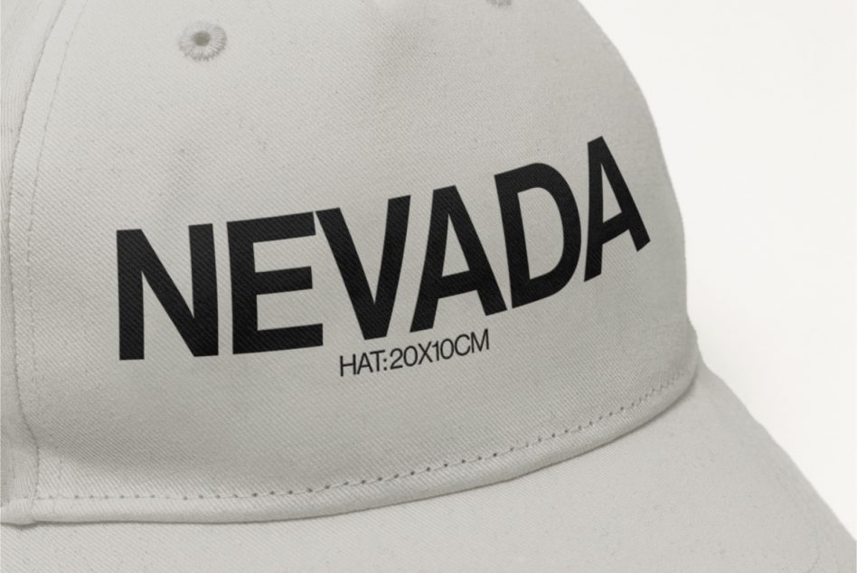 Close-up view of a white cap with black 'NEVADA' text, mockup design for customization, dimensions labeled, ideal for fashion branding.