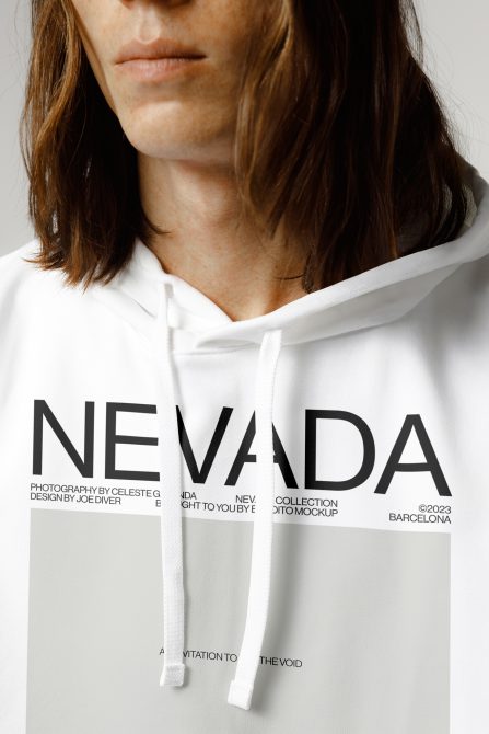 Close-up of a white hoodie mockup with customizable design area worn by a model for fashion template presentation.