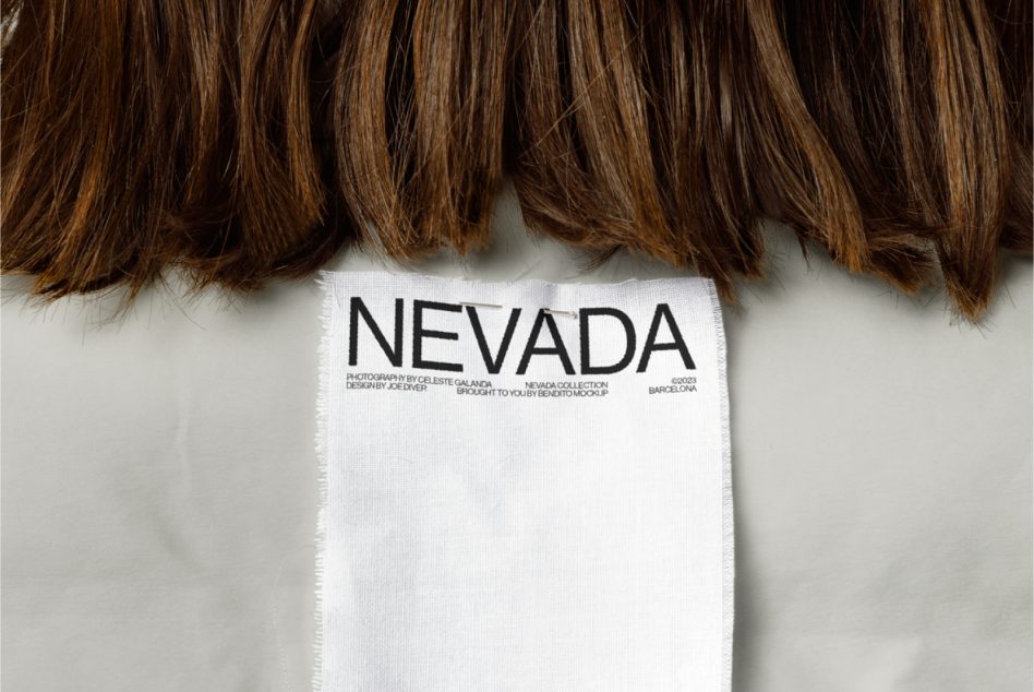 Close-up of hanging tag on brunette hair with Nevada branding visible