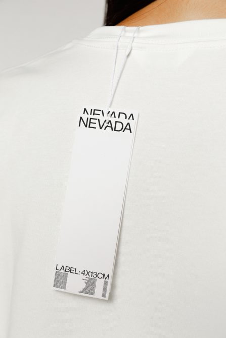 White t-shirt with a vertical hang tag mockup for fashion branding, high-res template design with editable label details.