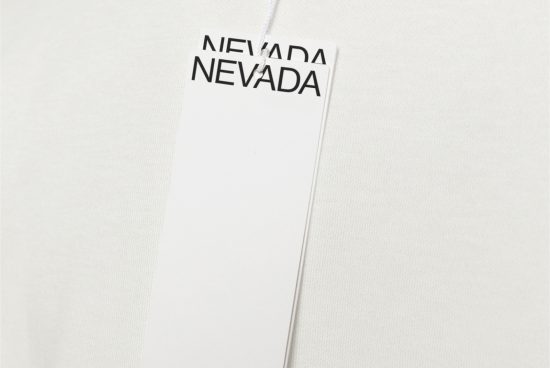 Clothing tag mockup on a fabric texture with Nevada text, ideal for branding design presentations in fashion and retail.