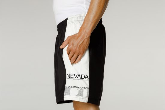 Man in sportswear shorts mockup for fashion design on a plain background, ideal for apparel mockups and templates.
